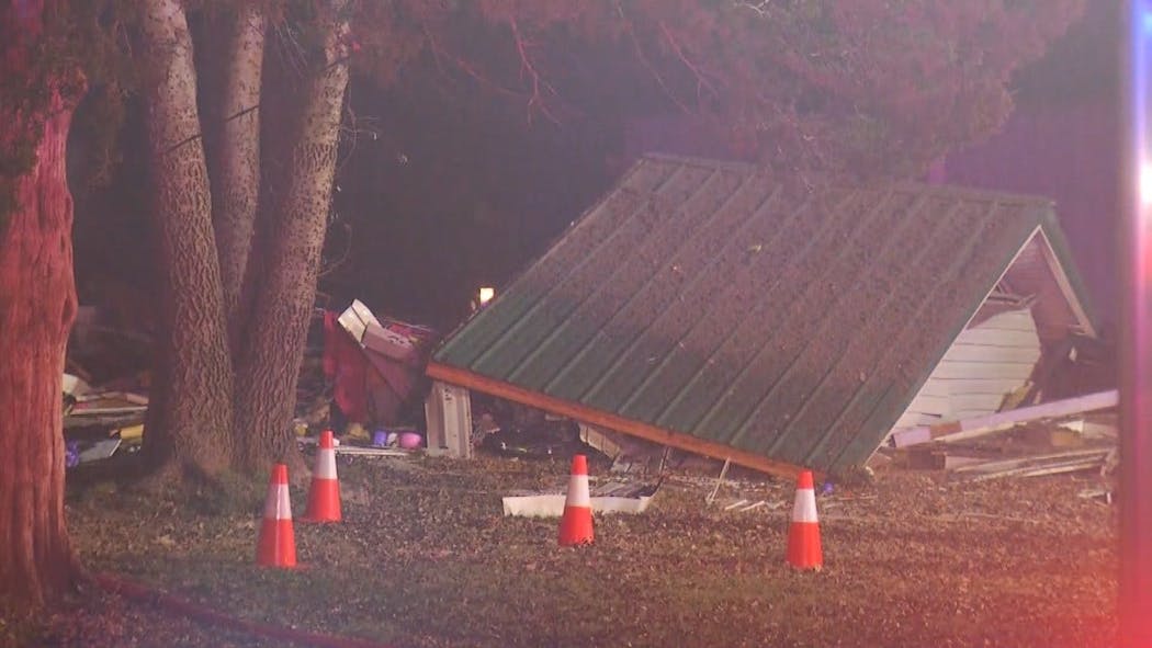 Fire Investigators Search Through Debris Of Leonard House Explosion