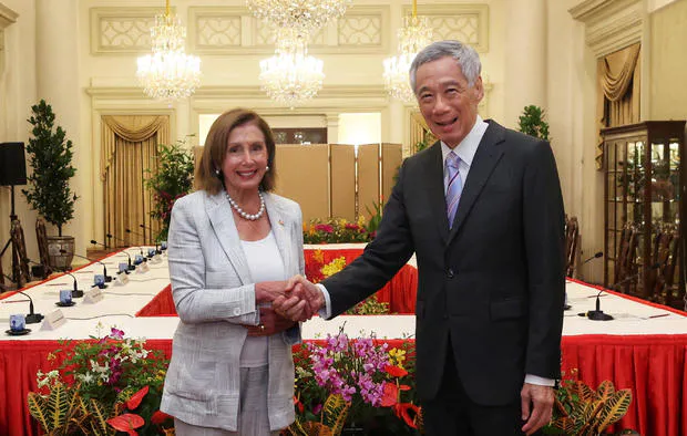House Speaker Nancy Pelosi shakes hands with Singapore's Prime