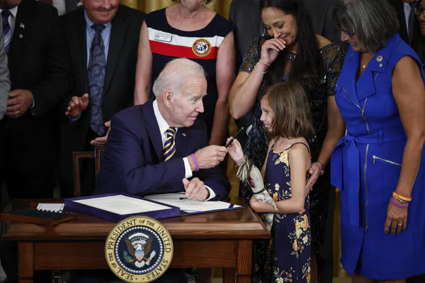 President Biden on Wednesday signed into law legislation that 