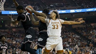 Carr Leads No. 23 Texas Past Oklahoma State 56-51