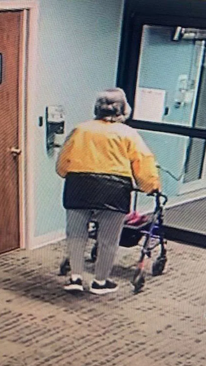 old woman walking away