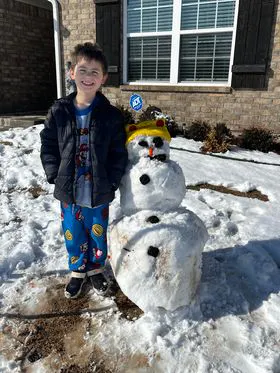 Boy with snowman