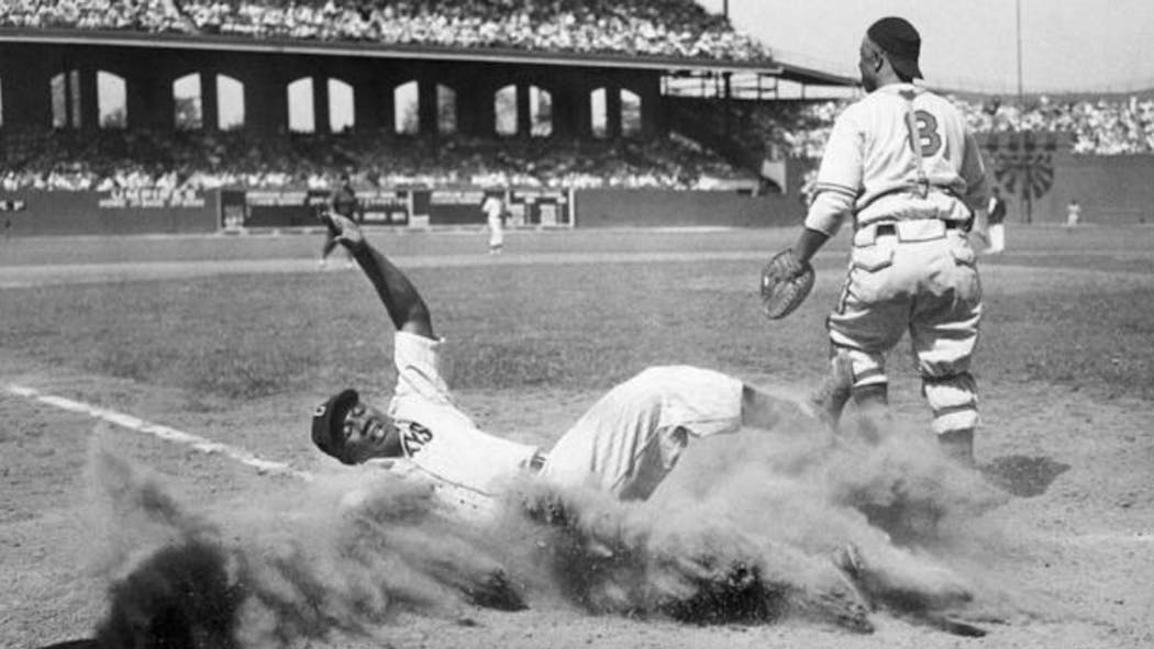 Josh Gibson slides into home plate, Aug. 13, 1944.